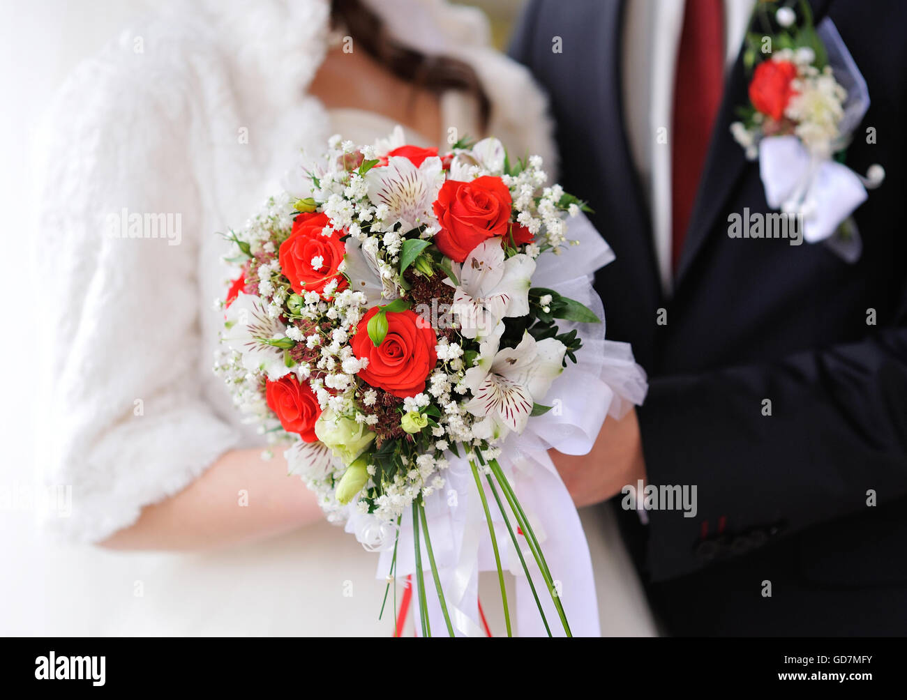 Bride and groom holding bridal bouquet close up Stock Photo