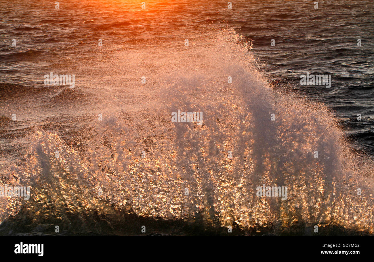 Wave splashing to the shore in dusk in Baltic Sea, in Utö Island in Finland Stock Photo