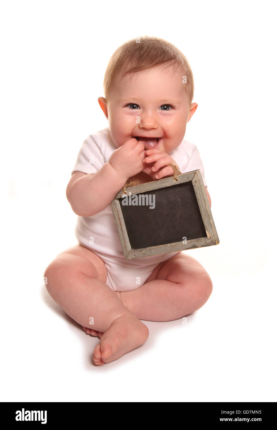 Baby girl holding blank chalkboard sign cutout Stock Photo