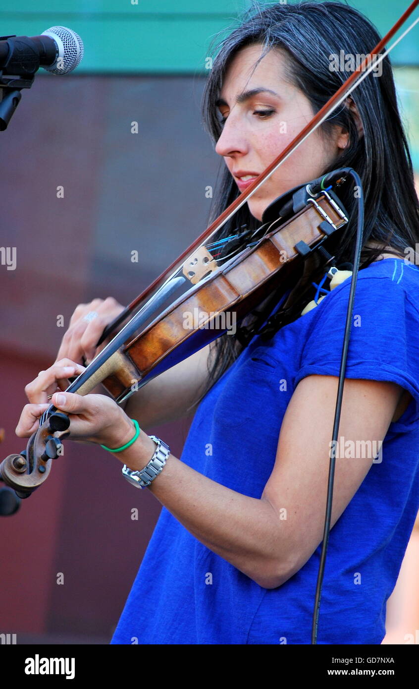 Female violinist performing outdoors. Stock Photo