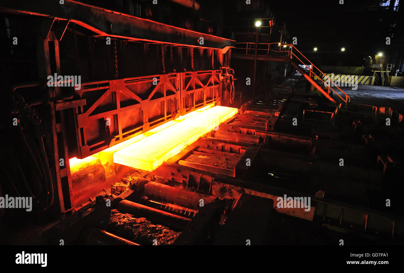 hot slab on conveyor in steel plant Stock Photo