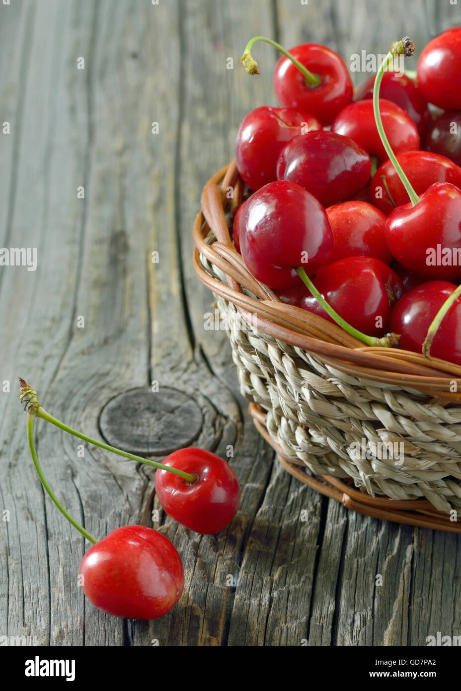 red sweet cherries in a  basket Stock Photo