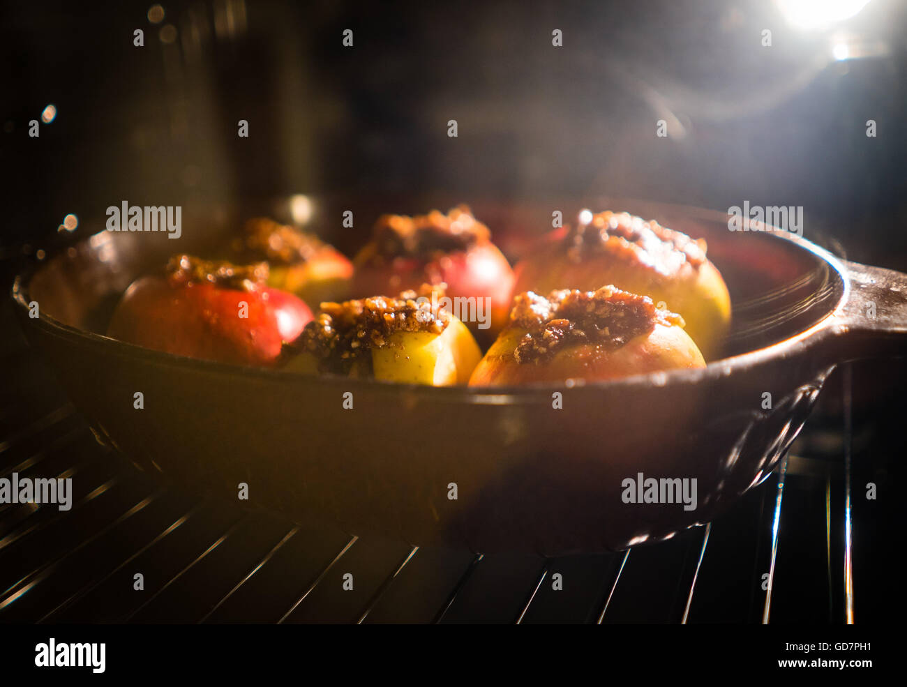 baked apple baking in oven at kitchen Stock Photo Alamy