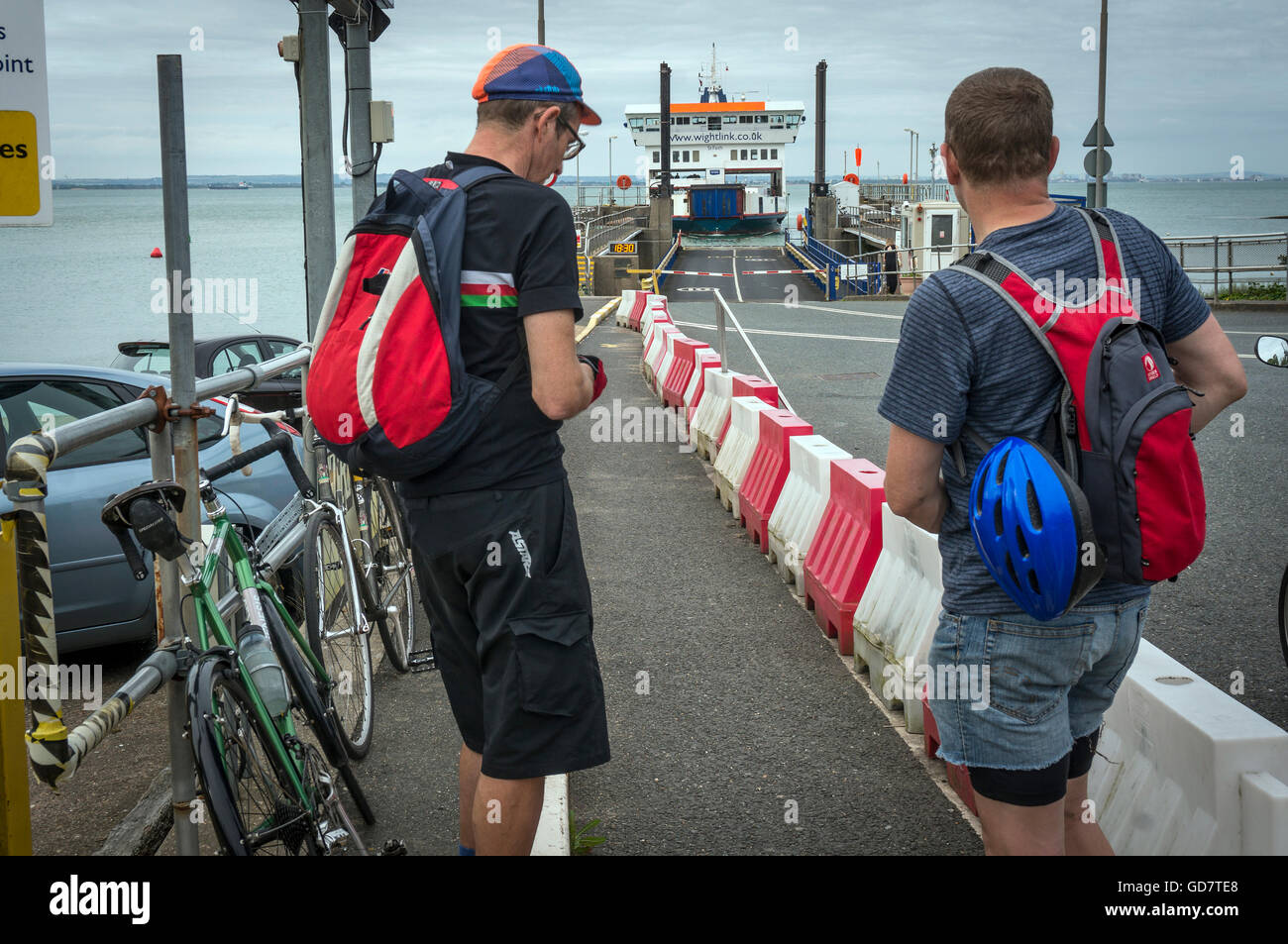 Cyclists waiting to board the Wightlink ferry from Fishbourne on the Isle of Wight, UK Stock Photo