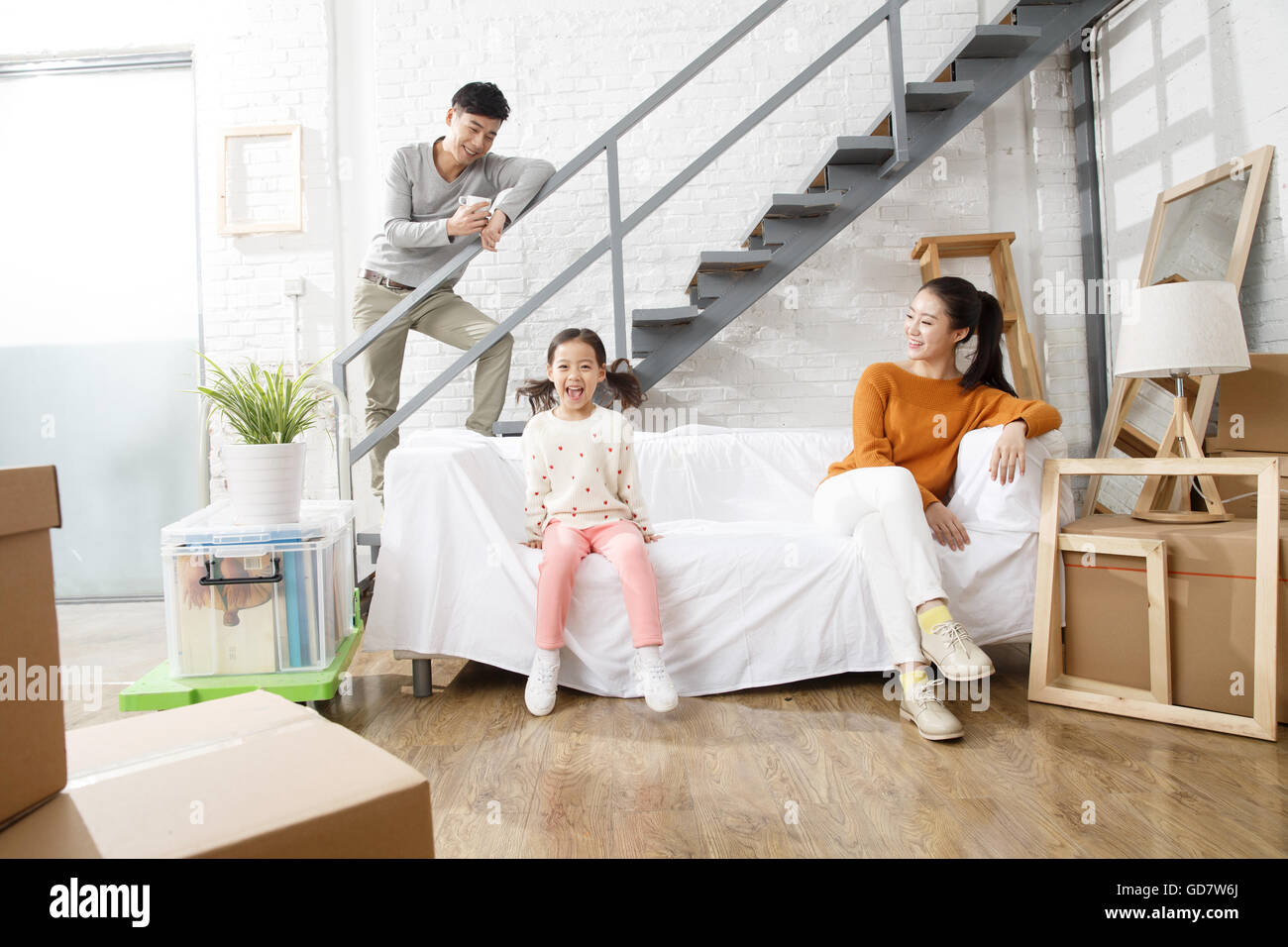 Happy family moved to new home Stock Photo - Alamy