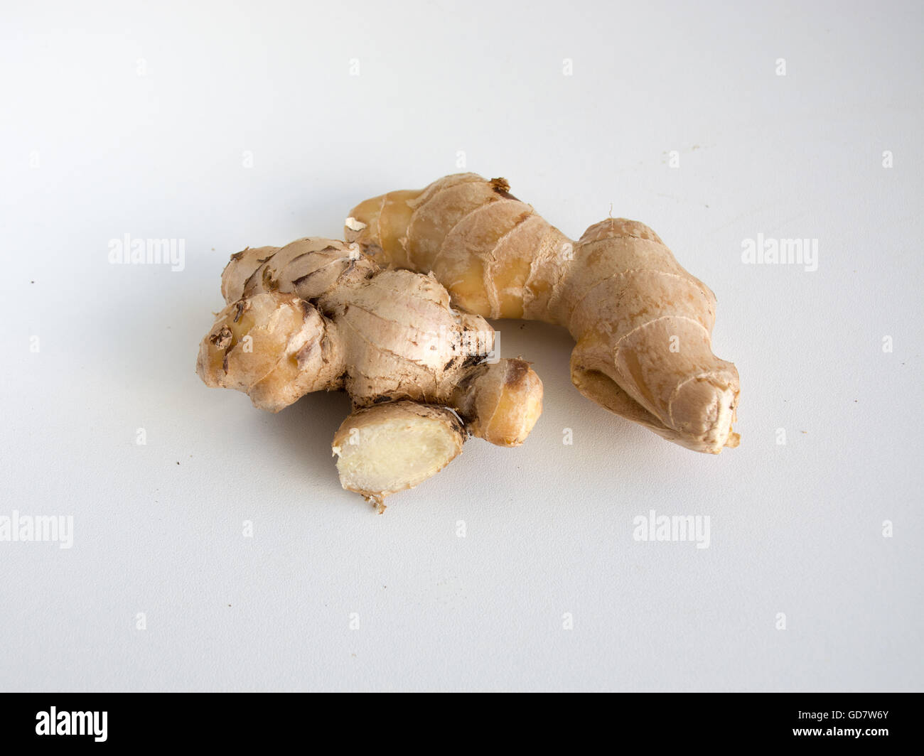 Two knobs of fresh whole ginger on a white background Stock Photo Alamy