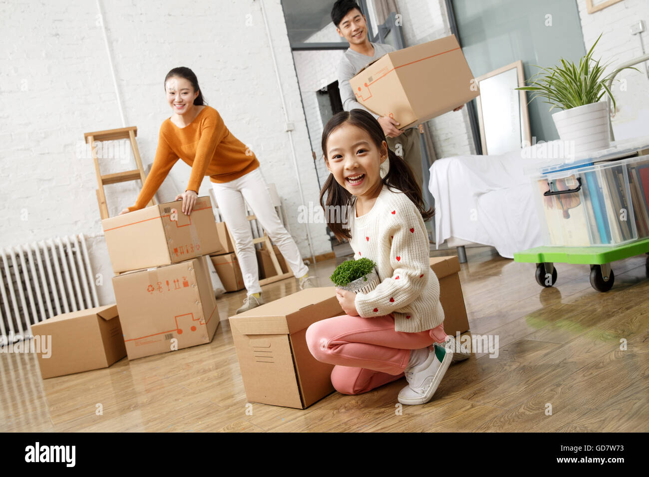 Happy family moved to new home Stock Photo - Alamy