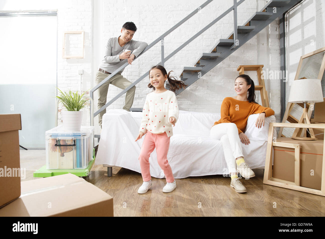 Happy family moved to new home Stock Photo - Alamy