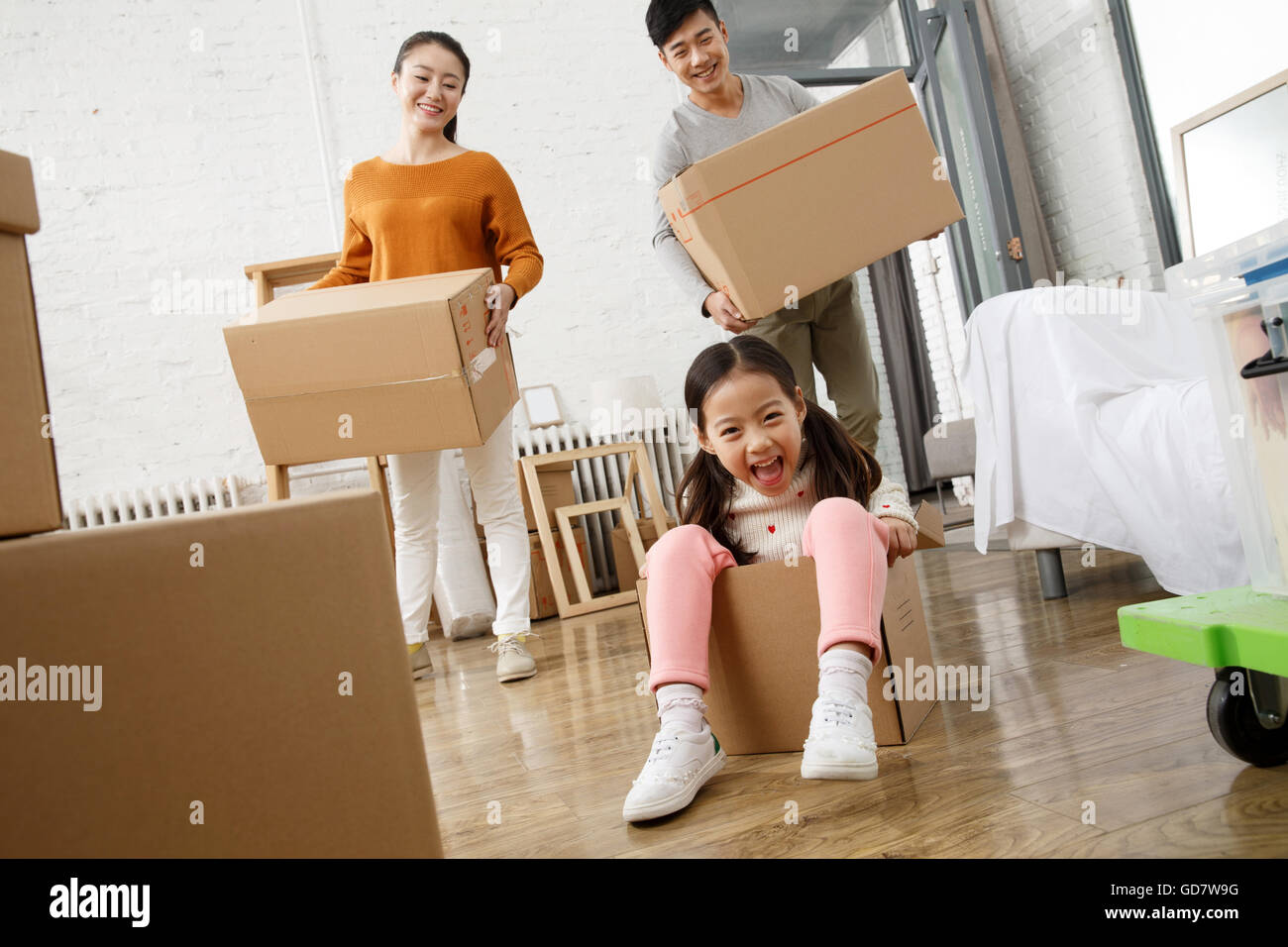 Happy family moved to new home Stock Photo - Alamy