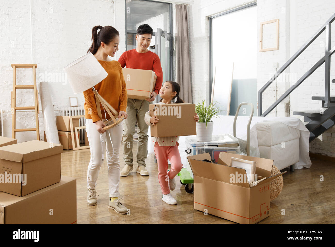 Happy family moved to new home Stock Photo - Alamy