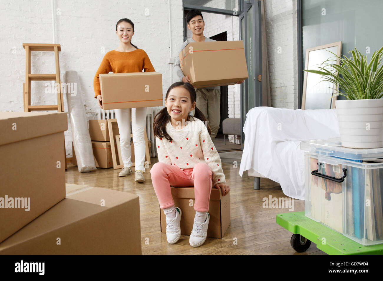 Happy family moved to new home Stock Photo - Alamy