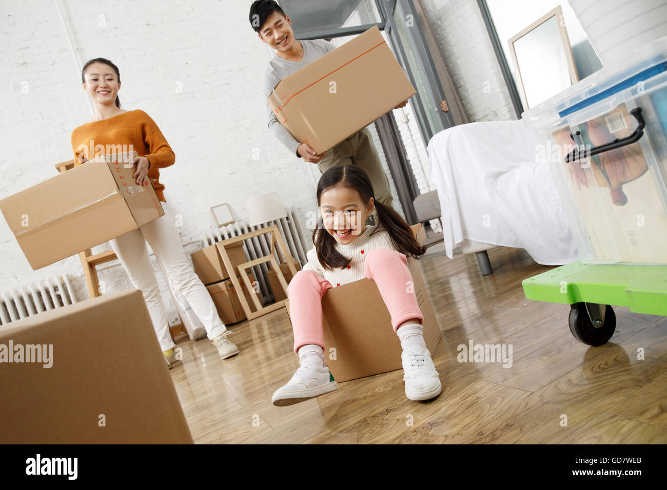 Happy family moved to new home Stock Photo - Alamy