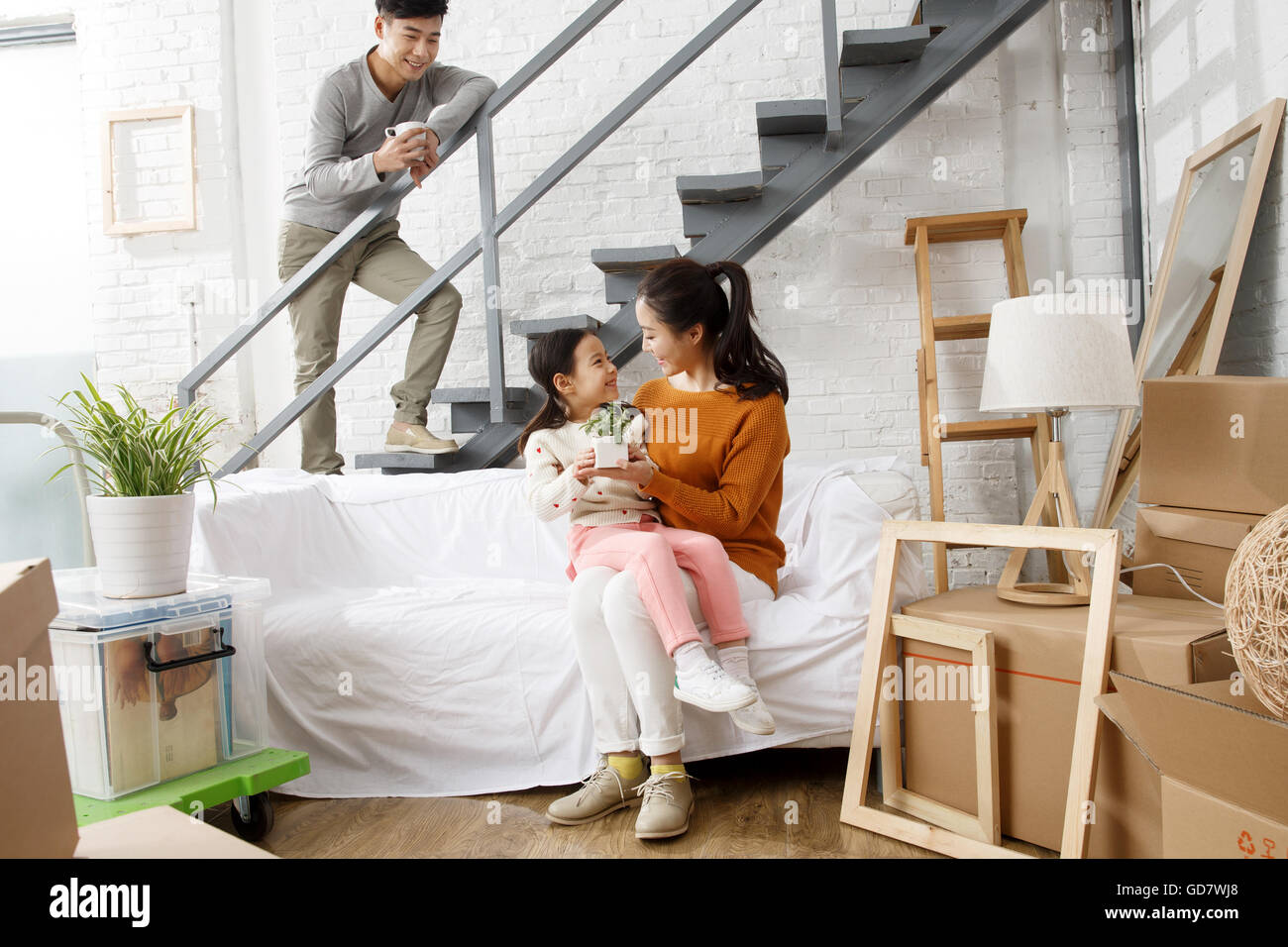 Happy family moved to new home Stock Photo - Alamy