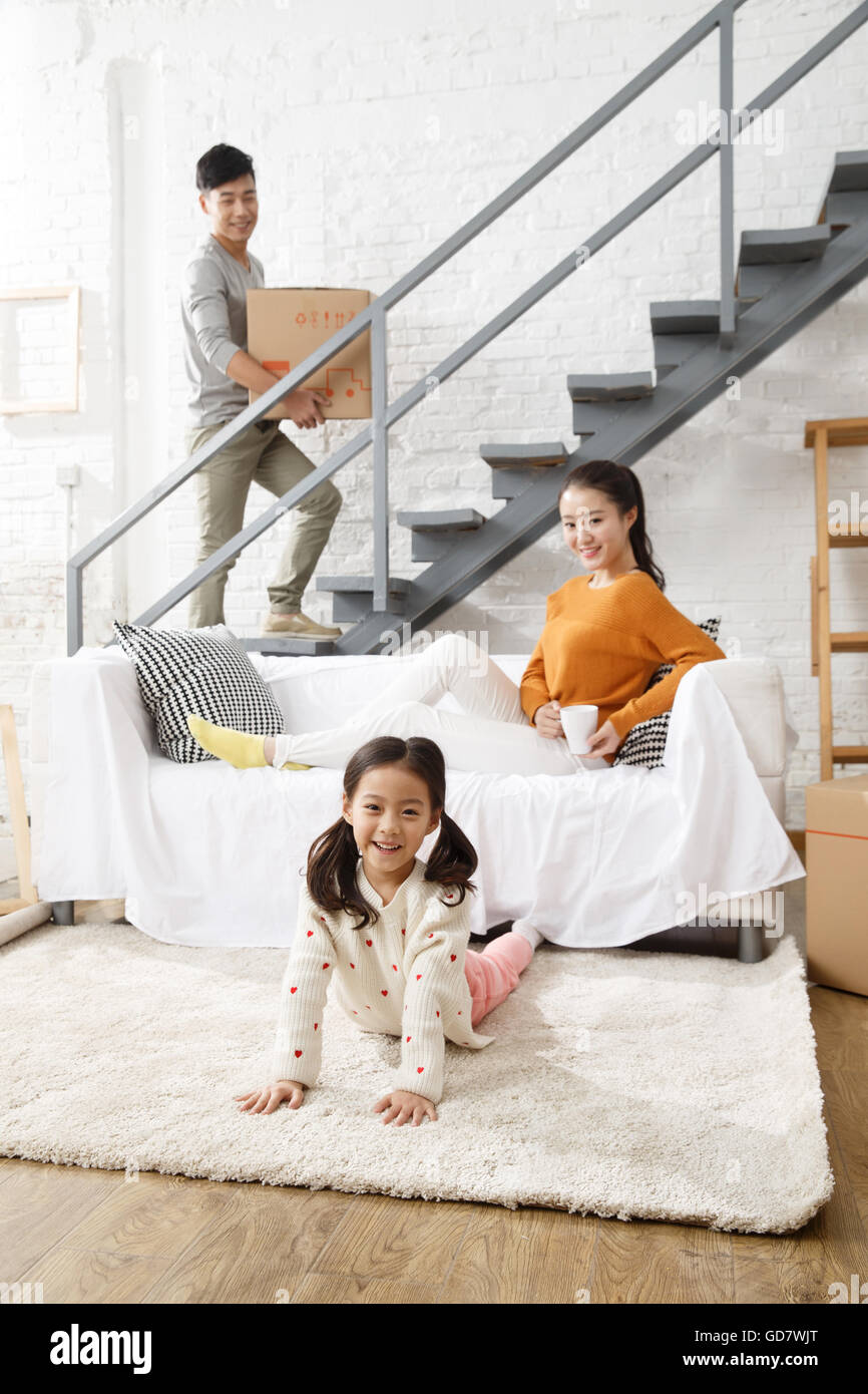 Happy family moved to new home Stock Photo - Alamy