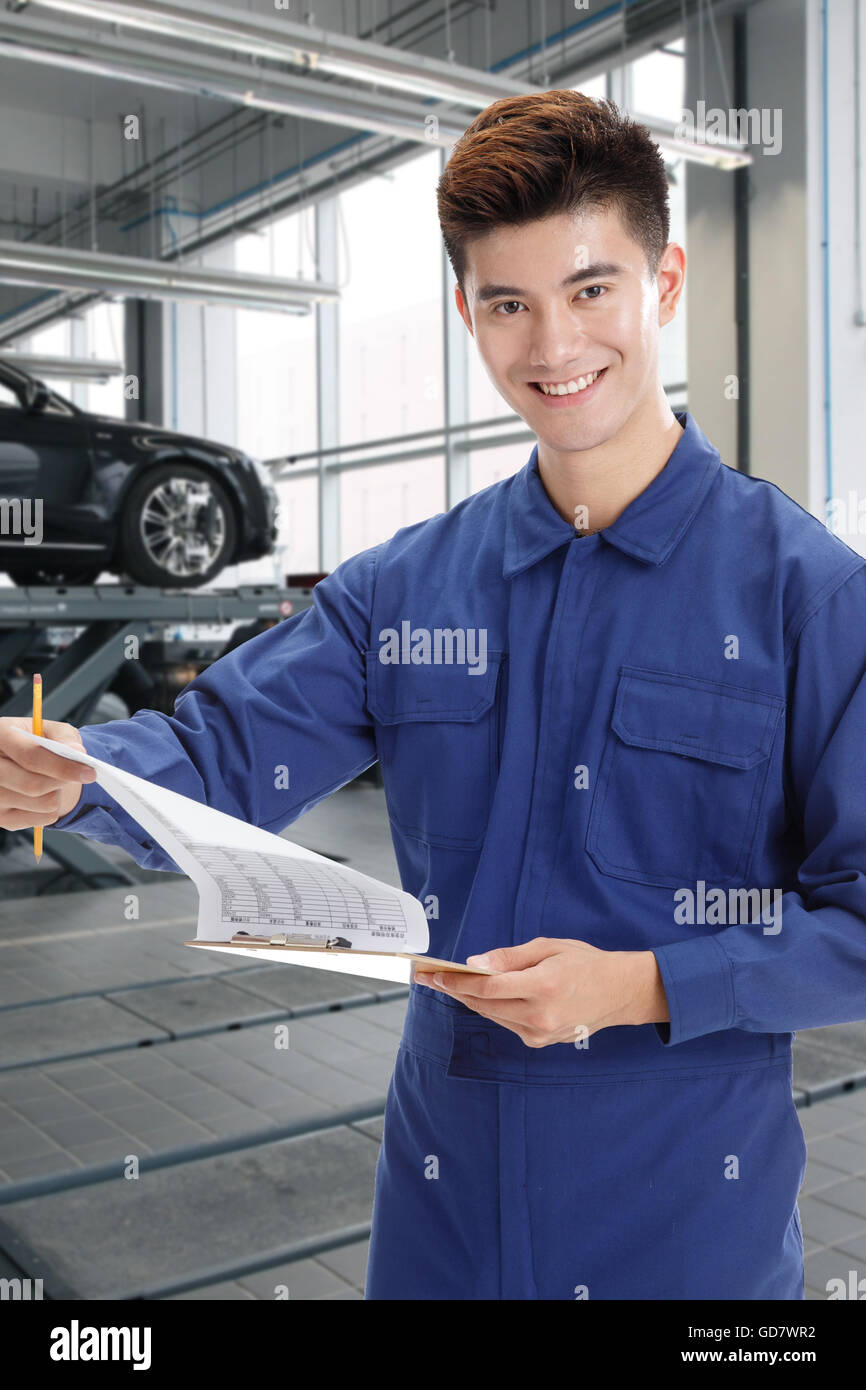 Car repair workers at work Stock Photo Alamy
