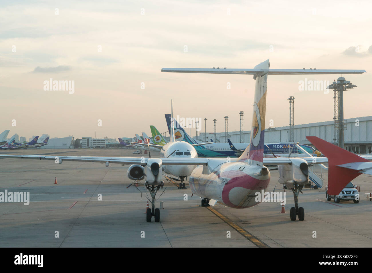 airplanes of Nok air at the Don Muang Airport in Bangkok in Thailand in southeastasia. Stock Photo