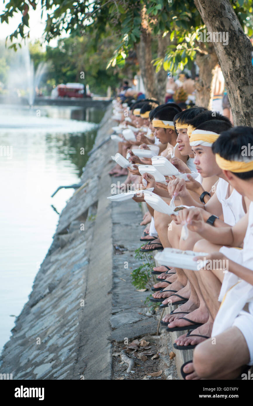 traditional dresst people at the night parade at the Loy Krathong Festival in the city of Chiang Mai in North Thailand in Thaila Stock Photo