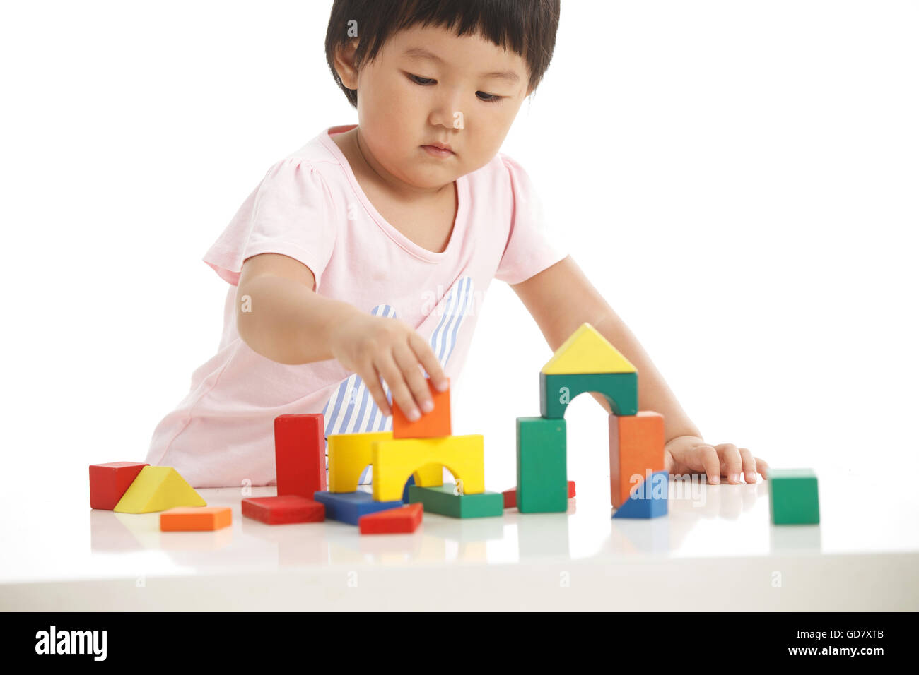 Little girls play with toys Stock Photo - Alamy