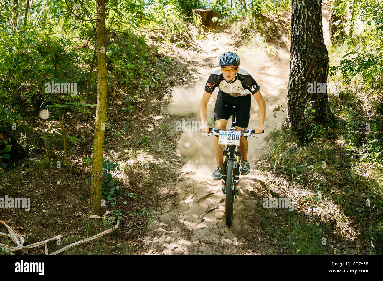GOMEL, BELARUS - JUNE 7, 2015: Mountain Bike cyclist riding track at sunny day, healthy lifestyle active athlete doing sport Stock Photo