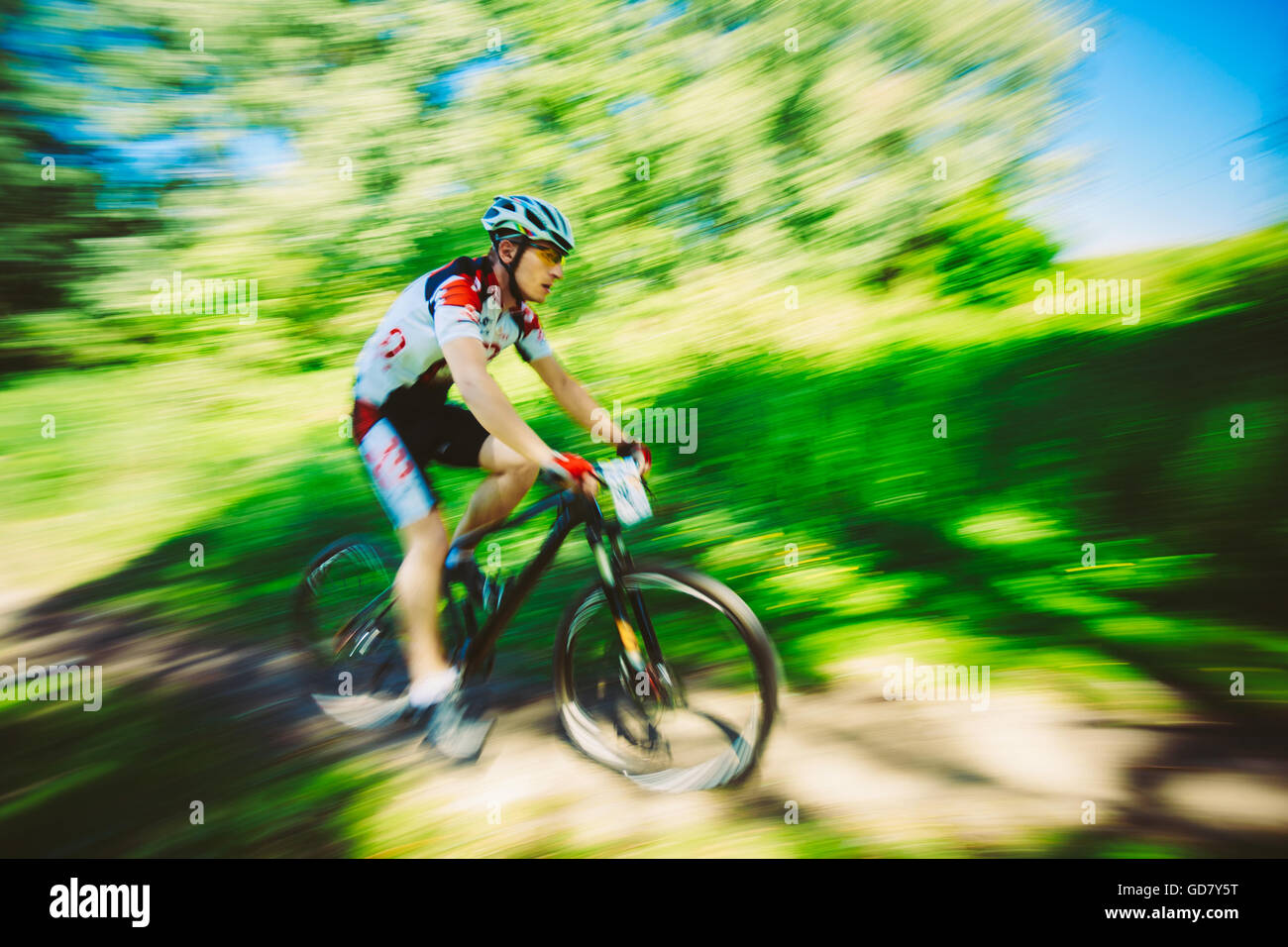 Mountain Bike cyclist riding track at sunny day, healthy lifestyle active athlete doing sport Stock Photo