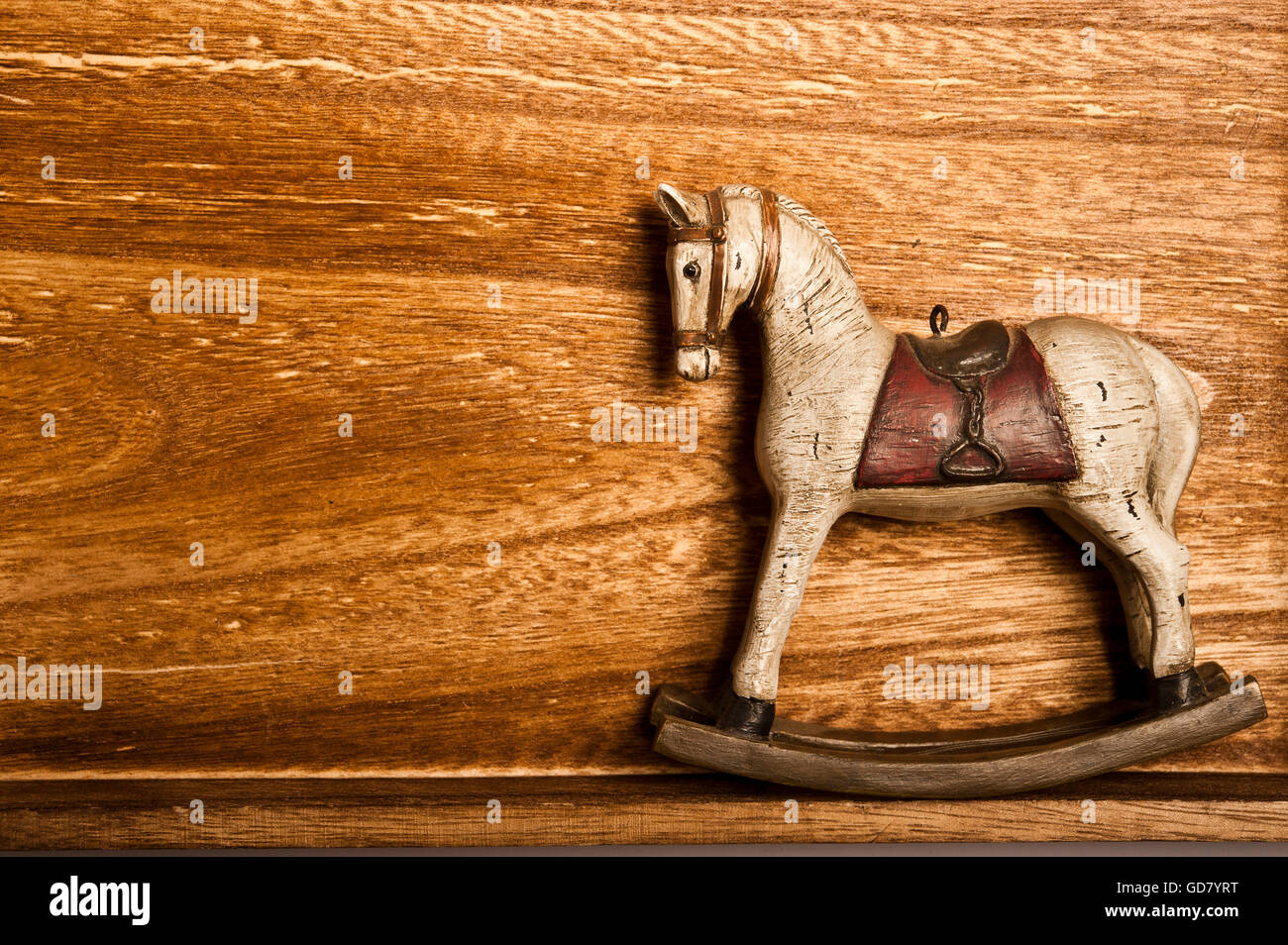 vintage rocking horse on wood Stock Photo