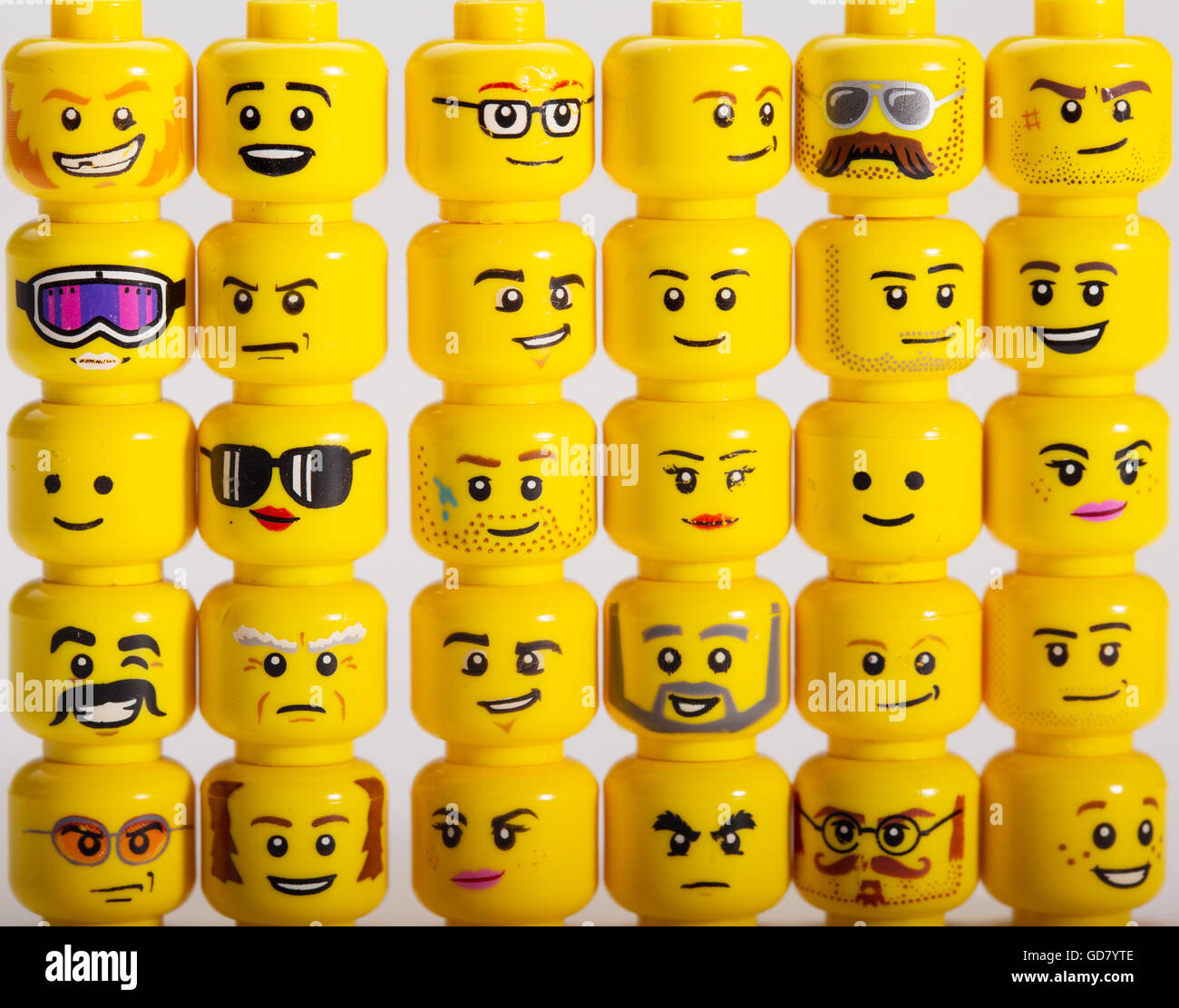 A selection of Lego Mini figure heads Stock Photo