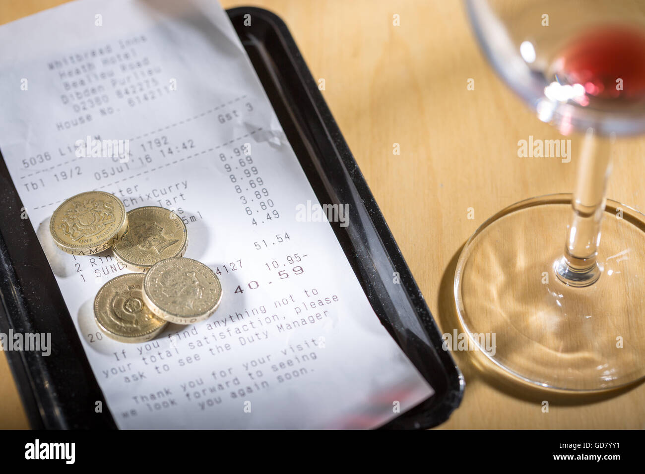Leaving a tip for the waiter / waitress after a meal in a restaurant Stock Photo