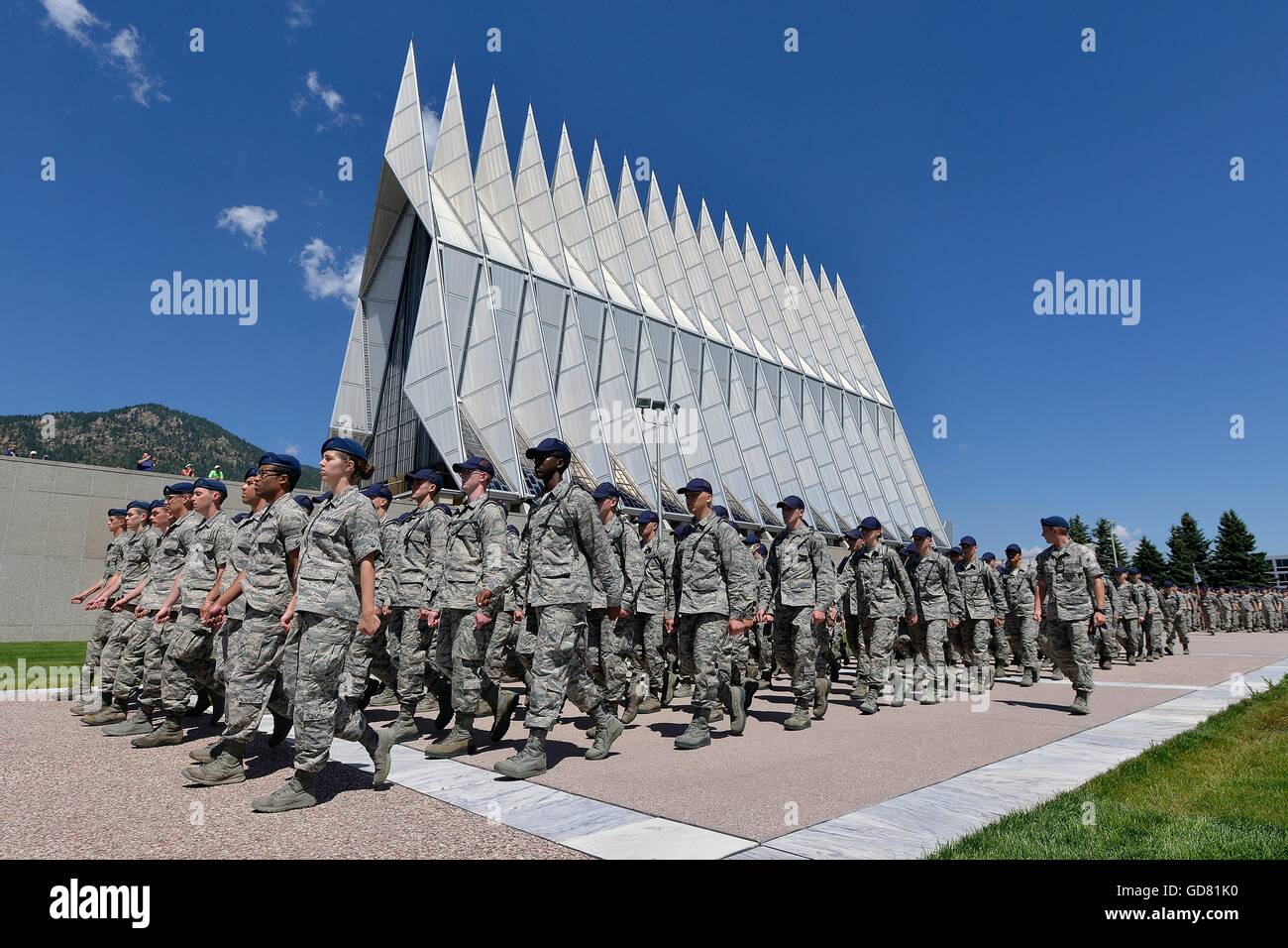 Incoming freshman students known as doolies march in formation past the chapel during lunch assembly during Basic Cadet Training at the U.S Air Force Academy July 8, 2016 in Colorado Springs, Colorado. The rigorous six-week Basic Cadet Training program acquaints cadets with military life before the start of the academic year. Stock Photo