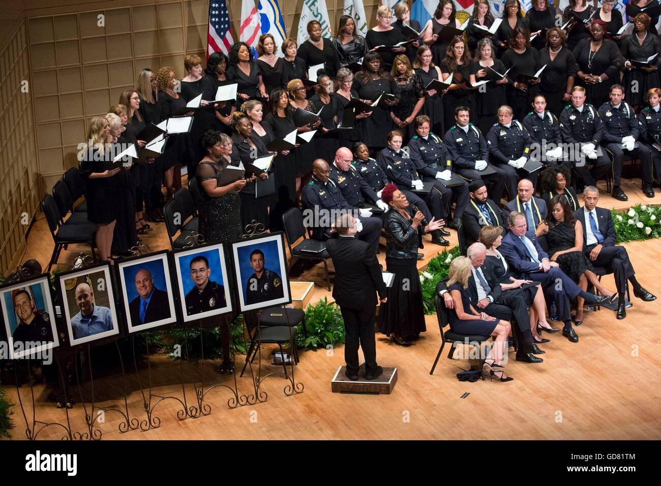 U.S President Barack Obama sits with First Lady Michelle Obama, former President George W. Bush and Laura Bush, Vice President Joe Biden and Dr. Jill Biden during a memorial service for the five police officers who were killed by a sniper during protests July 11, 2016 in Dallas, Texas. Stock Photo
