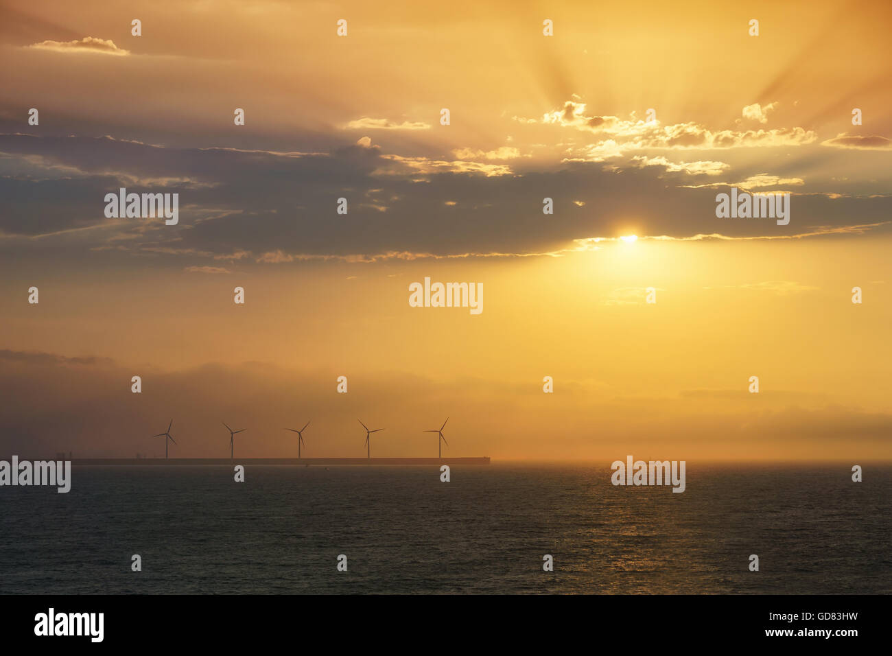 sea wind turbines at sunset Stock Photo - Alamy