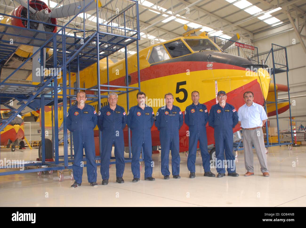 Firefighter aircraft Canadair CL-215 and maintenance crew at the Turkish Air Association-THK Etimesgut Airport's hangar Stock Photo