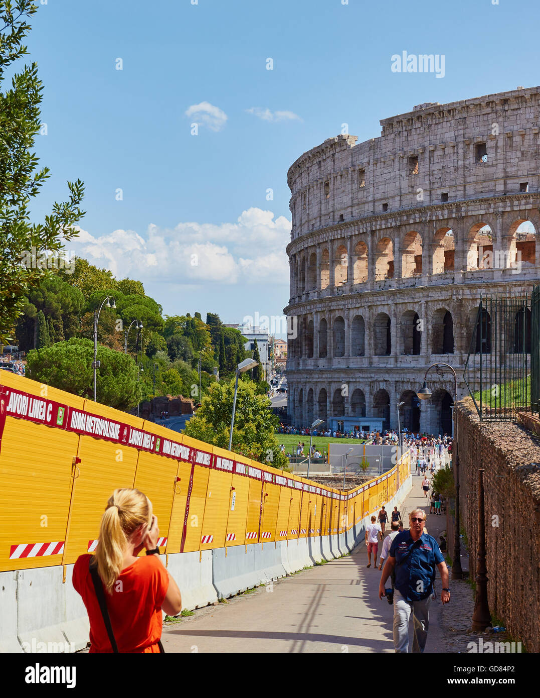 The Colosseum and barriers enclosing construction of new metro line C Rome Lazio Italy Europe Stock Photo