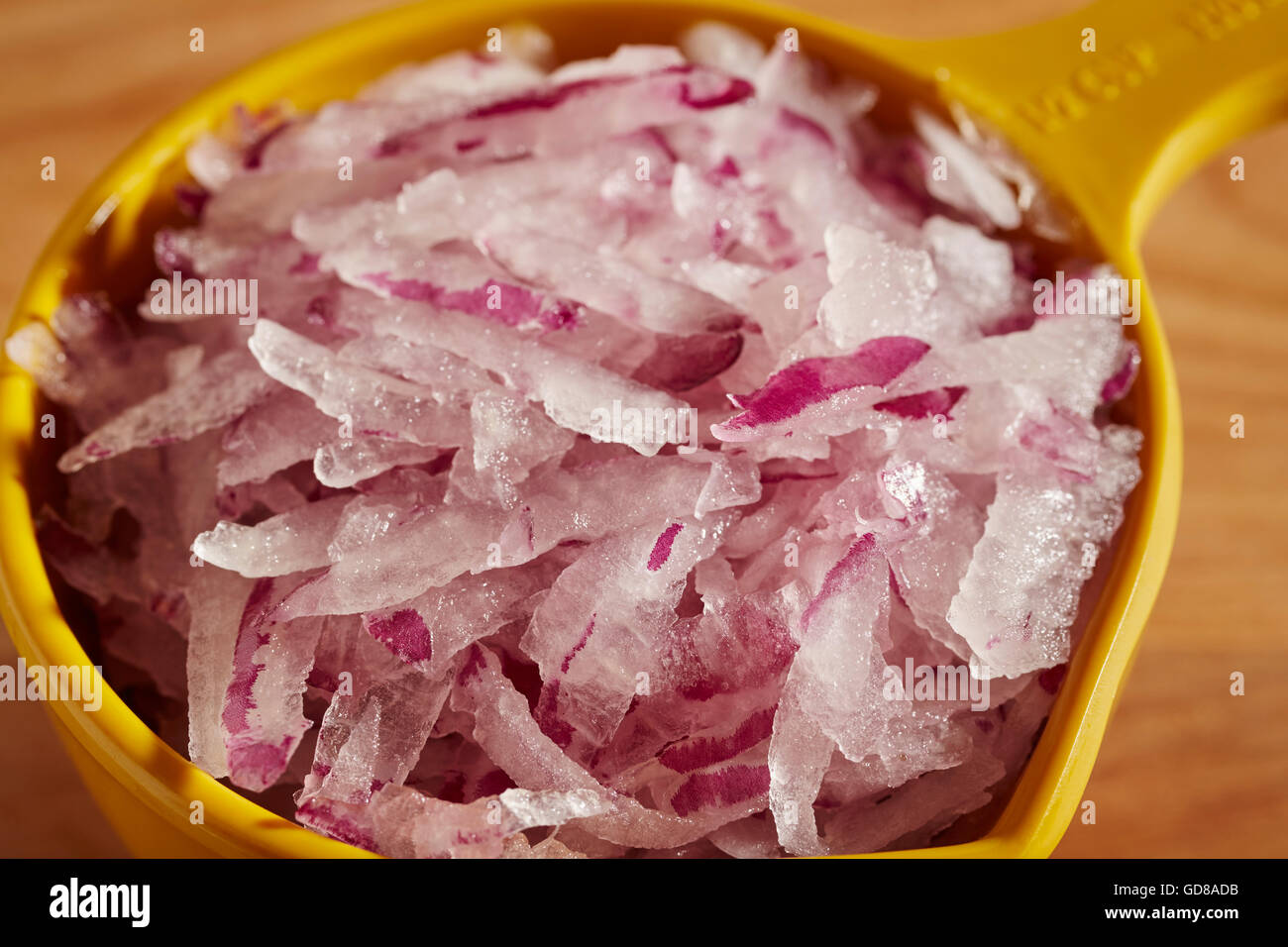 Onions being grated – License Images – 12337962 ❘ StockFood