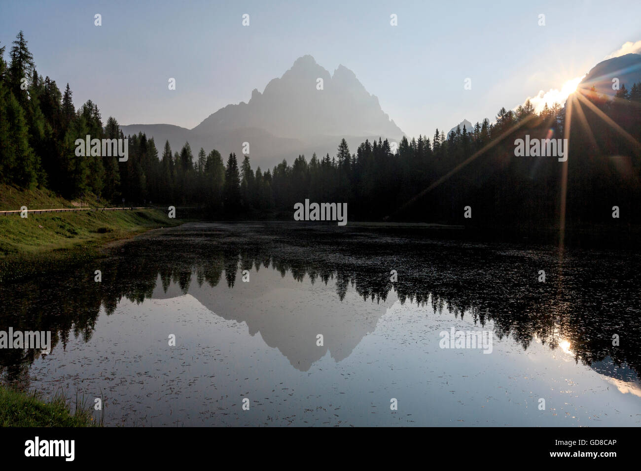 The Three Peaks of Lavaredo are reflected in Lake Antorno at sunrise Veneto Sesto Dolomites Italy Europe Stock Photo
