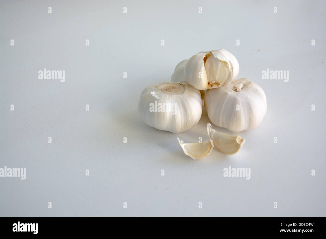 Fresh white garlic heads and clove on white background Stock Photo - Alamy
