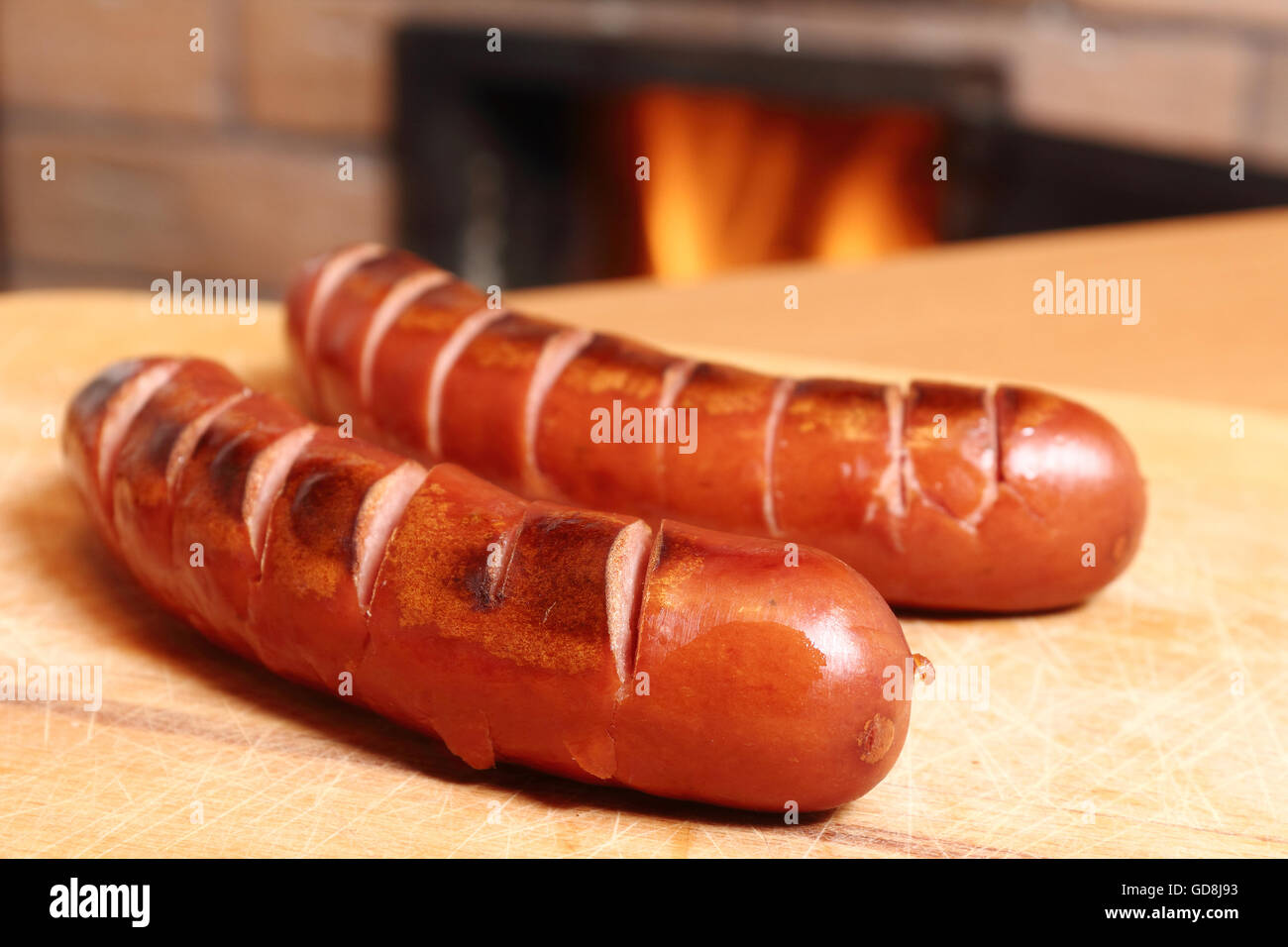 Grilled sausages at masonry oven background Stock Photo Alamy