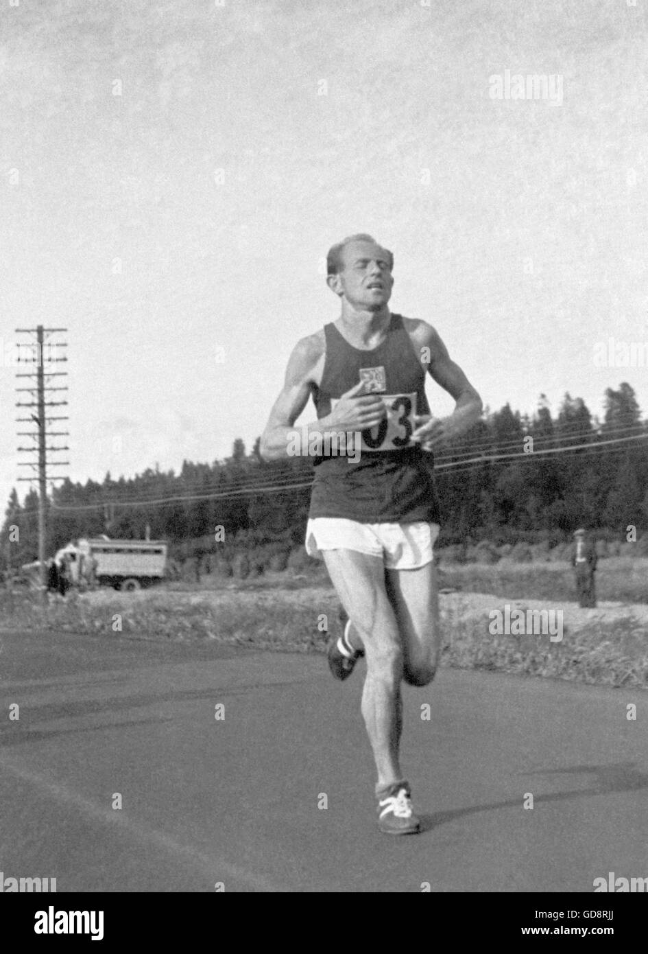 Finland 1952 Olympics, Emil Zatopek, four time Olympic gold medalist winning running 35 km marathon race with number 903 at Helsinki. Stock Photo