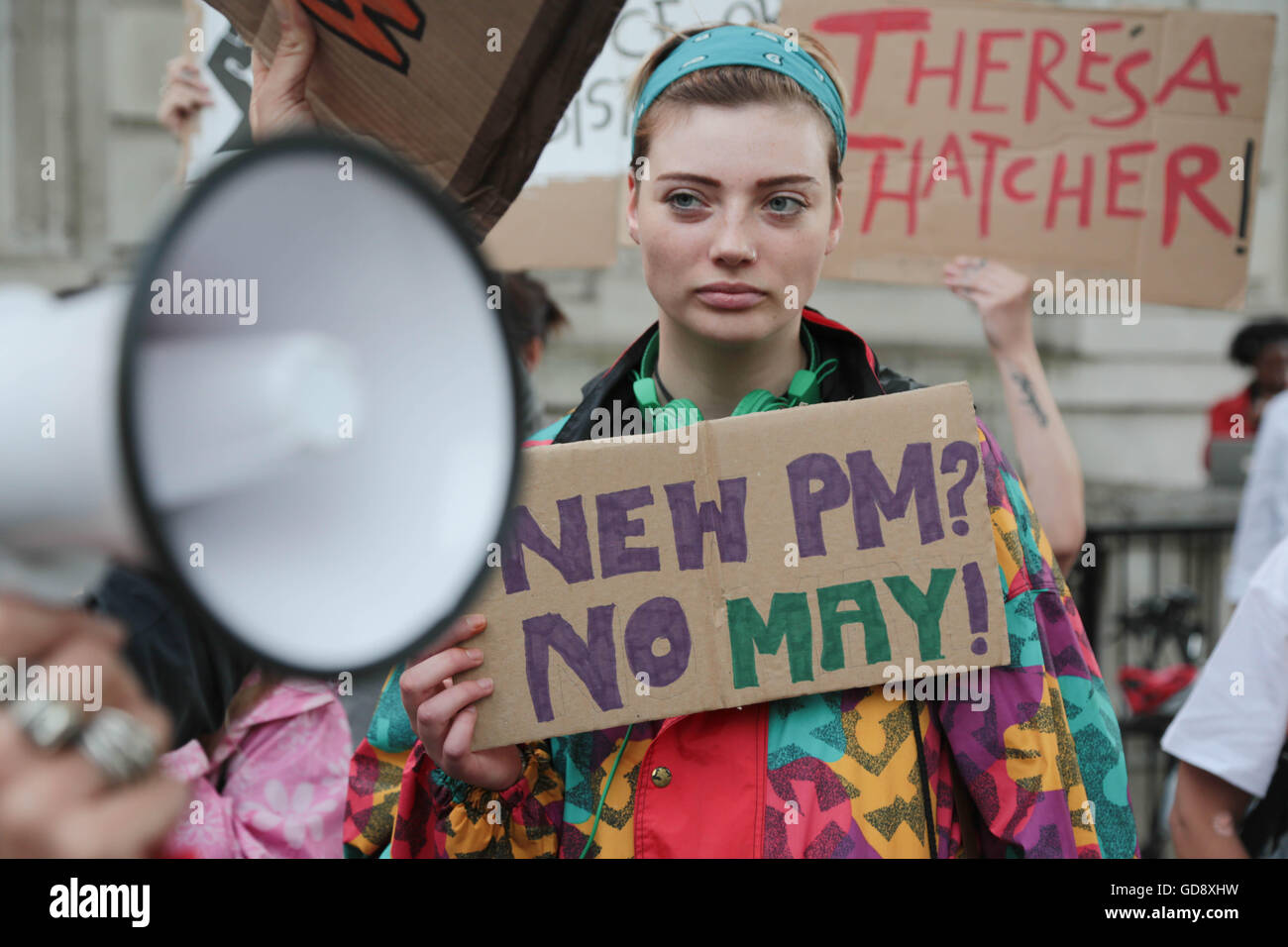 London UK. 13 July 2016 Demonstrators holding placards and Banners out side the gates of Downing street call on the new prime minster Theresa may to call a general election because they say she as no Mandate. Credit:  Thabo Jaiyesimi/Alamy Live News Stock Photo