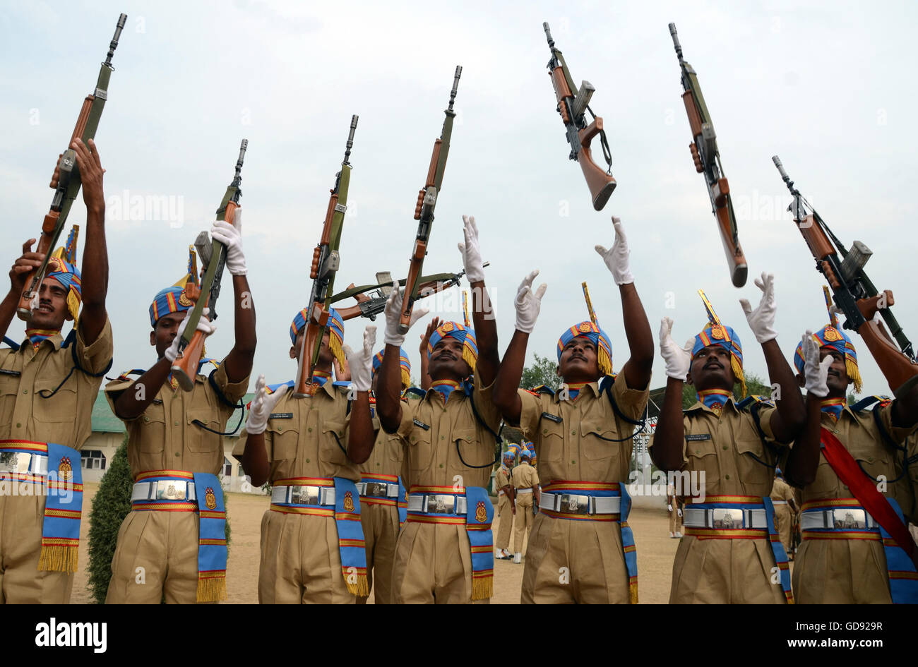 Srinagar, Indian Administered Kashmir. 14th July, 2016.  New recruits of Indian Central Reserve Police Force (C R P F)Constables throw their weapon in the air after completing their passing out parade in Humhama, on the outskirts of Srinagar,India.512 newly trained CRPF recruits took an oath to serve India by working in the police force during their passing out parade. The recruits have successfully completed their 44 weeks of training which involved, weapons handling, map reading and counter-insurgency operations. These recruits will join Indian paramilitary to fight militants in Kashmir,©Sof Stock Photo