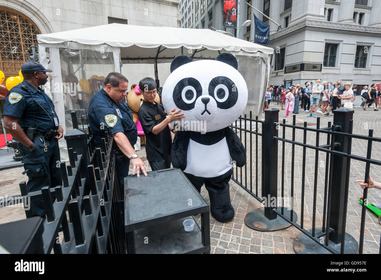 New York, USA. 14th July, 2016. Costumed characters representing Line 'stickers' in front of the New York Stock Exchange decorated for the Japanese messaging company Line's initial public offering on Thursday, July 14, 2016. Line Corp., a popular messaging app in Japan is owned by South Korean Naver Corp. Line has 218 million active users monthly, with Japan, Taiwan and Indonesia accounting for two-thirds of them.  Credit:  Richard Levine/Alamy Live News Stock Photo
