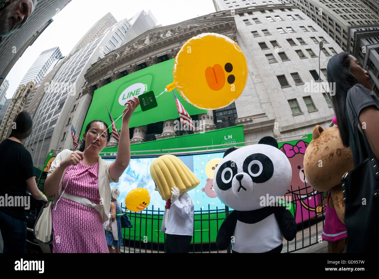 New York, USA. 14th July, 2016. Costumed characters representing Line 'stickers' in front of the New York Stock Exchange decorated for the Japanese messaging company Line's initial public offering on Thursday, July 14, 2016. Line Corp., a popular messaging app in Japan is owned by South Korean Naver Corp. Line has 218 million active users monthly, with Japan, Taiwan and Indonesia accounting for two-thirds of them.  Credit:  Richard Levine/Alamy Live News Stock Photo