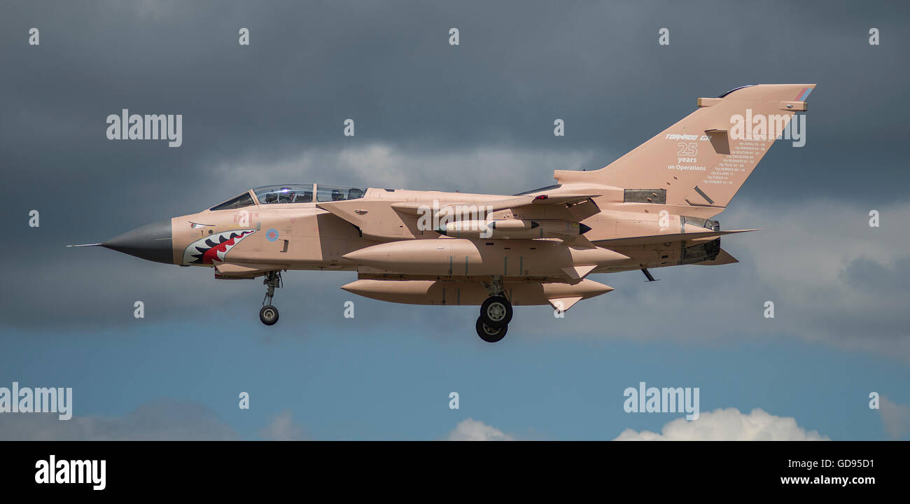 Farnborough, Hampshire UK. 14th July 2016. Day 4 of the Farnborough International Trade Airshow. Visiting RAF Tornado GR4 painted in Gulf War Desert Pink with a livery celebrating 25 years of combat operations touches down. Credit: aviationimages/Alamy Live News. Stock Photo