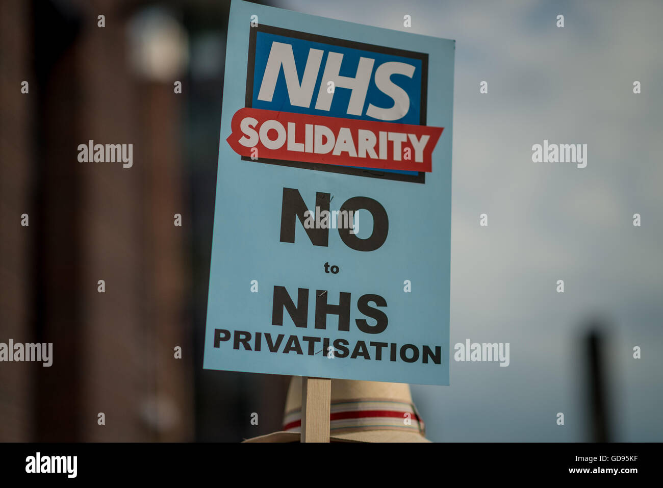 London, UK. 14th July, 2016. NHS Solidarity campaign organised protest this afternoon opposing cuts and attempts to ''˜market' NHS services.Activists including doctors, nurses and students protesting against privatisation and further cuts in NHS making the scheme of public health service in UK getting closer to US-style privatised, insurance-based system. Credit:  Velar Grant/ZUMA Wire/Alamy Live News Stock Photo