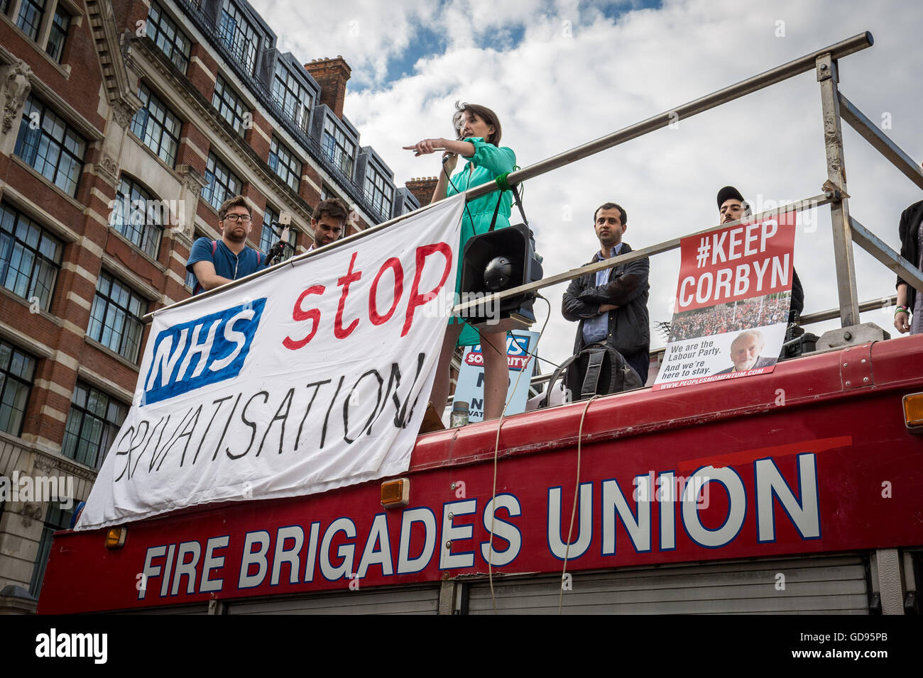 London, UK. 14th July, 2016. Defend Our NHS Protest in central London. Supporters and defenders of the National Health Service including doctors, nurses, junior doctors, fire fighters, unions reps and members of the public gathered near St. Bartholomew's Hospital before marching through St. Pauls to rally opposite the Cathedral in protest against the acceleration in on-going cuts and privatisation of the NHS Credit:  Guy Corbishley/Alamy Live News Stock Photo