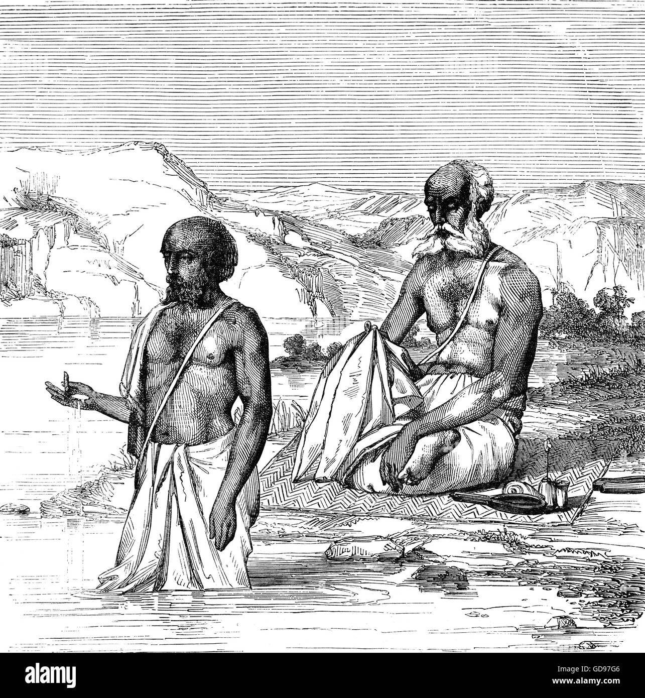 Brahmins, a varna (caste) in Hinduism in religious worship. They specialised as priests, teachers (acharya) and protectors of sacred learning across generations and were traditionally responsible for religious rituals in temples, as intermediaries between temple deities and devotees Stock Photo