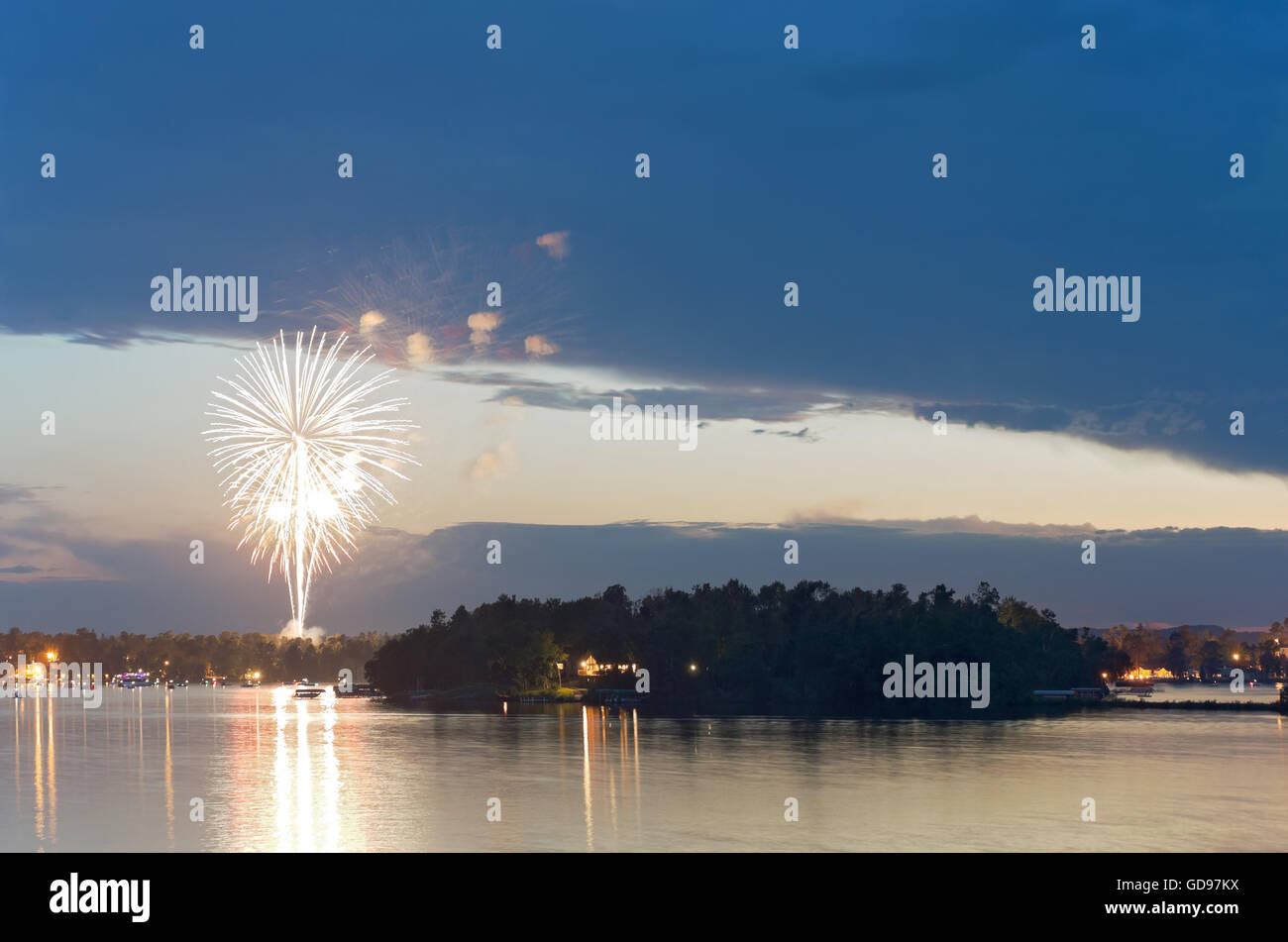 fourth of july fireworks display during celebration on steamboat bay of east gull lake near brainerd minnesota Stock Photo