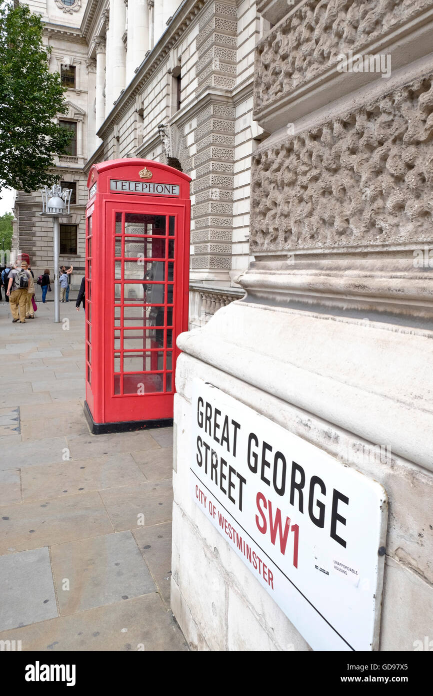 Great George Street SW1 road sign with iconic red telephone box Stock Photo