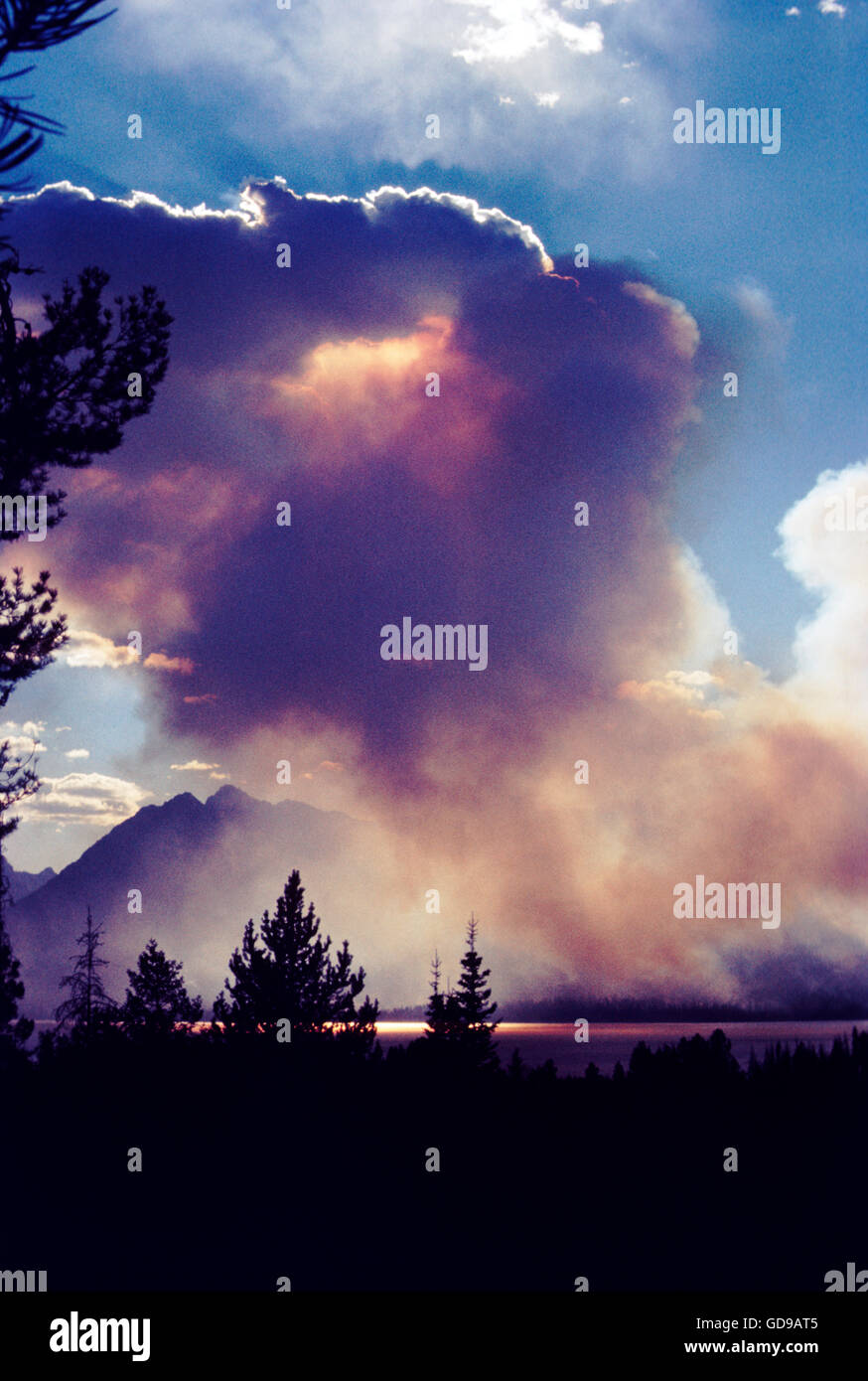 Forest fire creates dramatic skies over Jenny Lake; Grand Teton National Park; Wyoming; USA Stock Photo