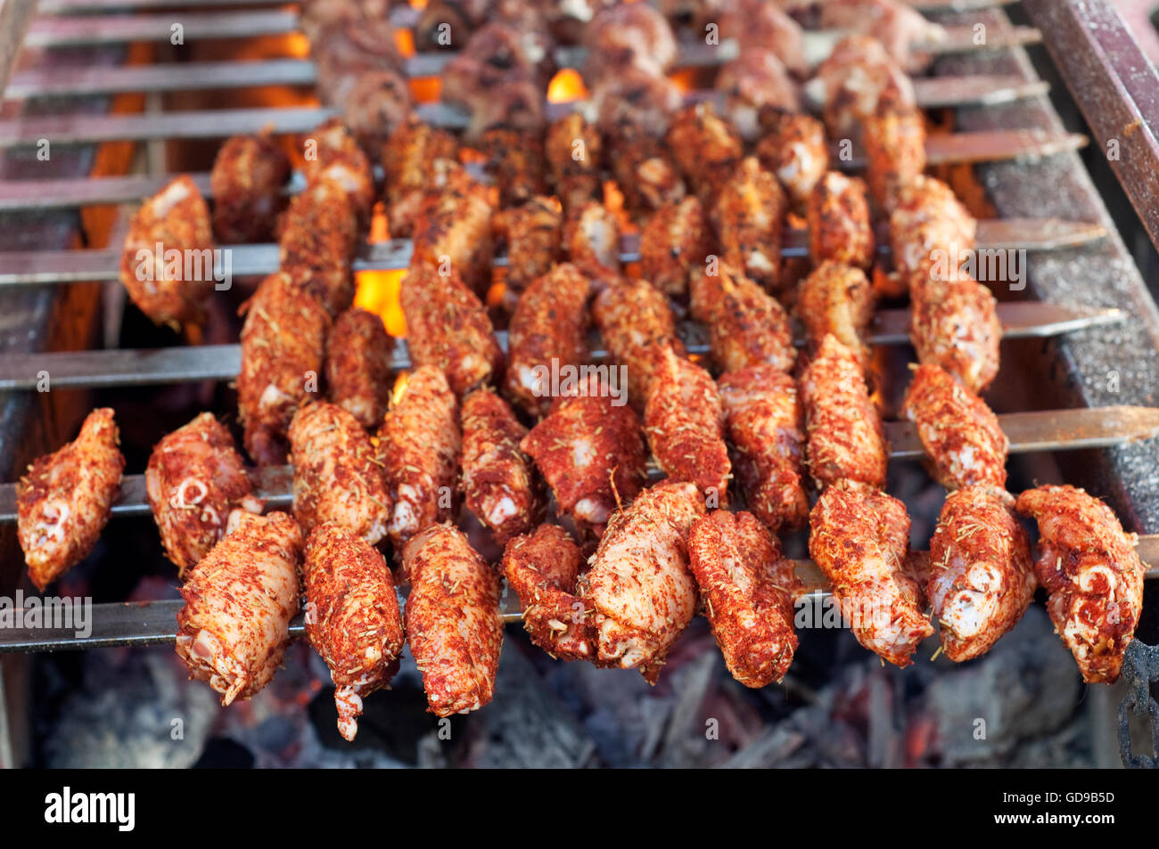 Italy, Lombardy, Street Food, Spicy Chicken Wings on the Grill Stock Photo