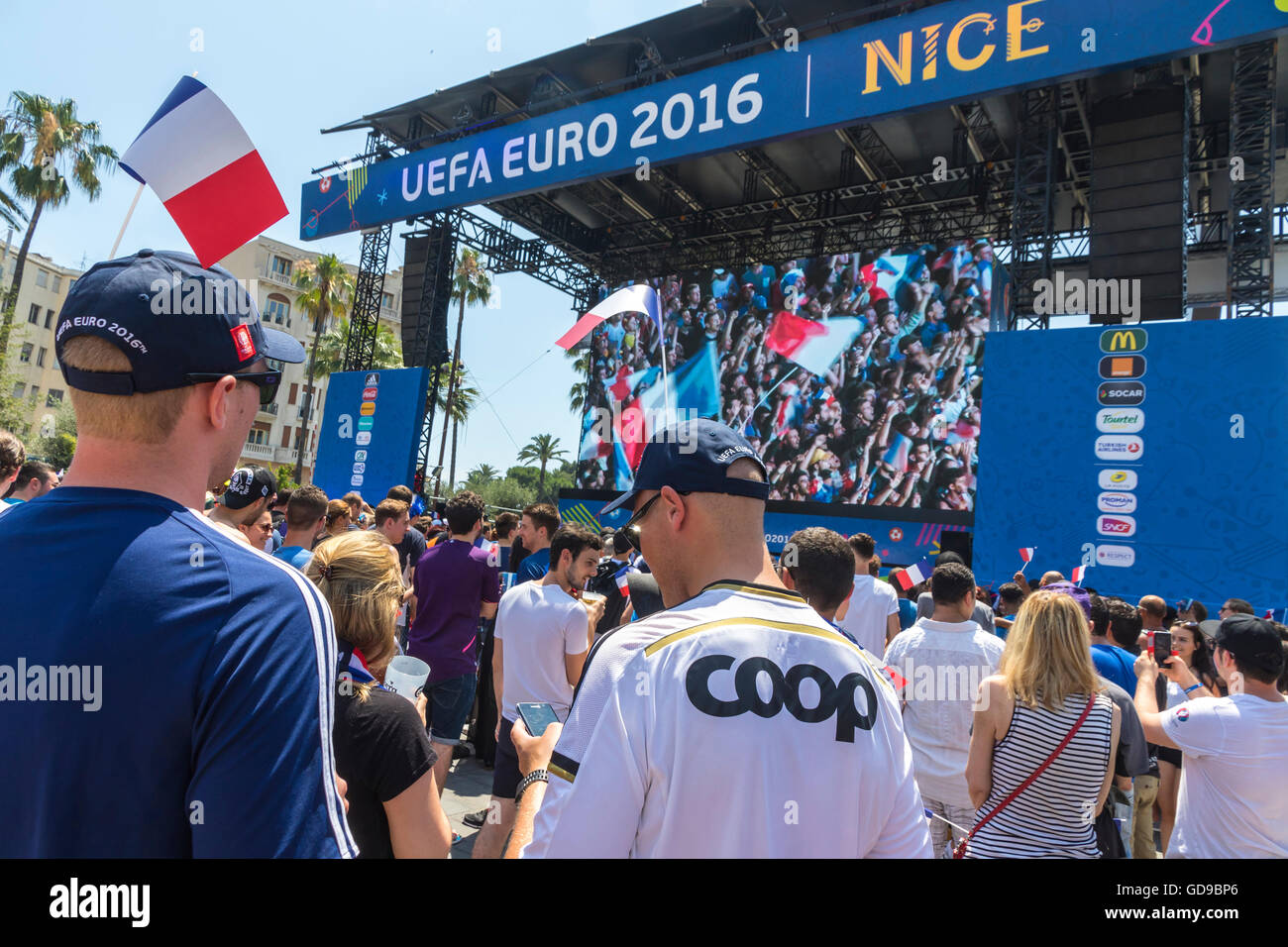 NICE, FRANCE - JUNE 26, 2016: People have fun at official fanzone of UEFA EURO 2016 at Albert I Garden in City of Nice, France Stock Photo